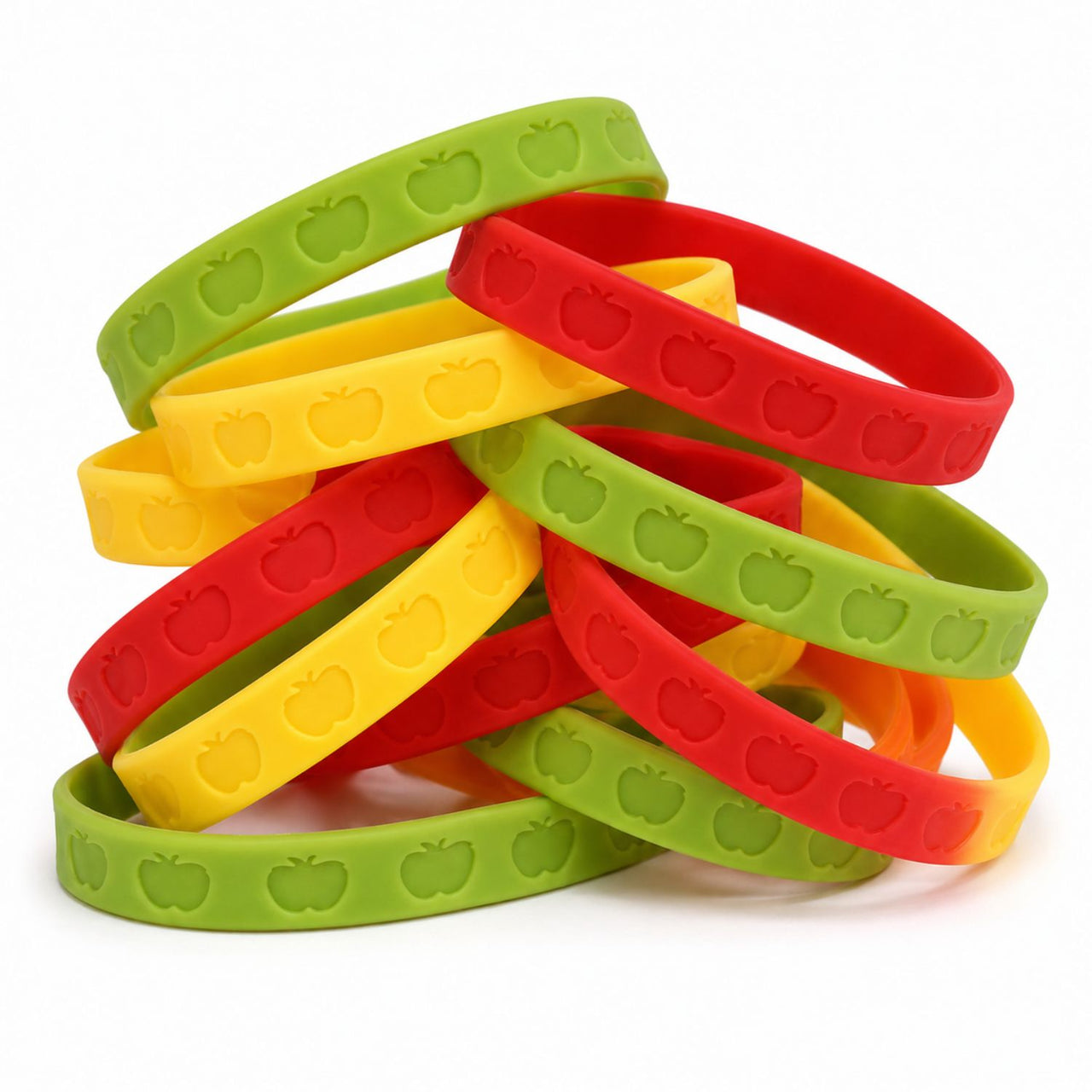 appple bracelets in a pile on a white background