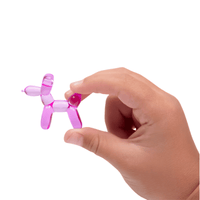 Thumbnail for small balloon dog figurine in a childs hand