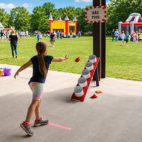 Thumbnail for bean bags used by a girl at a school carnival game