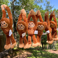 Thumbnail for plush bigfoot plush hanging outside