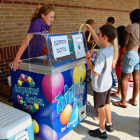 Thumbnail for boy using yellow star tickets to buy treat at a school carnival