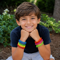 Thumbnail for boy smiling wearing colorful rope bracelet prizes