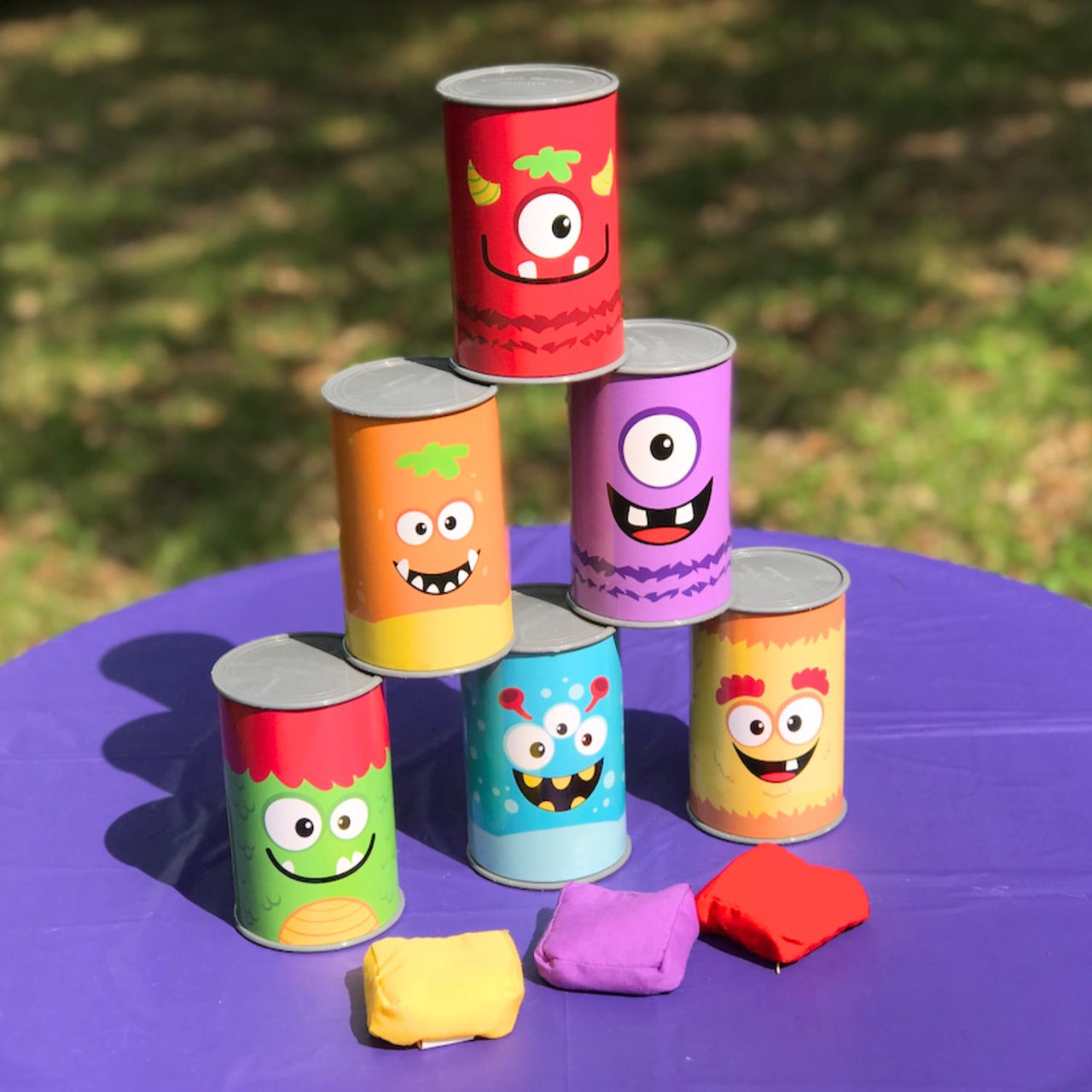 Plastic Monster Can Knock Down Game (Set includes 6 cans & 3 beanbags)