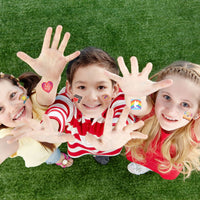Thumbnail for children outside with hands raised with temporary Christian tattoos