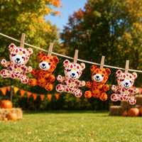 Thumbnail for cute fall themed plush bears outside at a fall festival