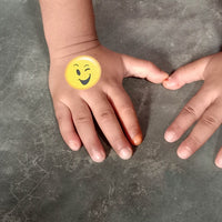 Thumbnail for washable emoji themed tattoo on a child's hand