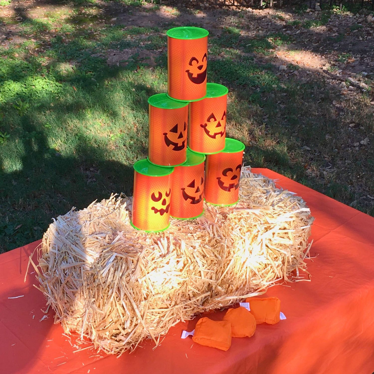 fall carnival game outside - can knock down