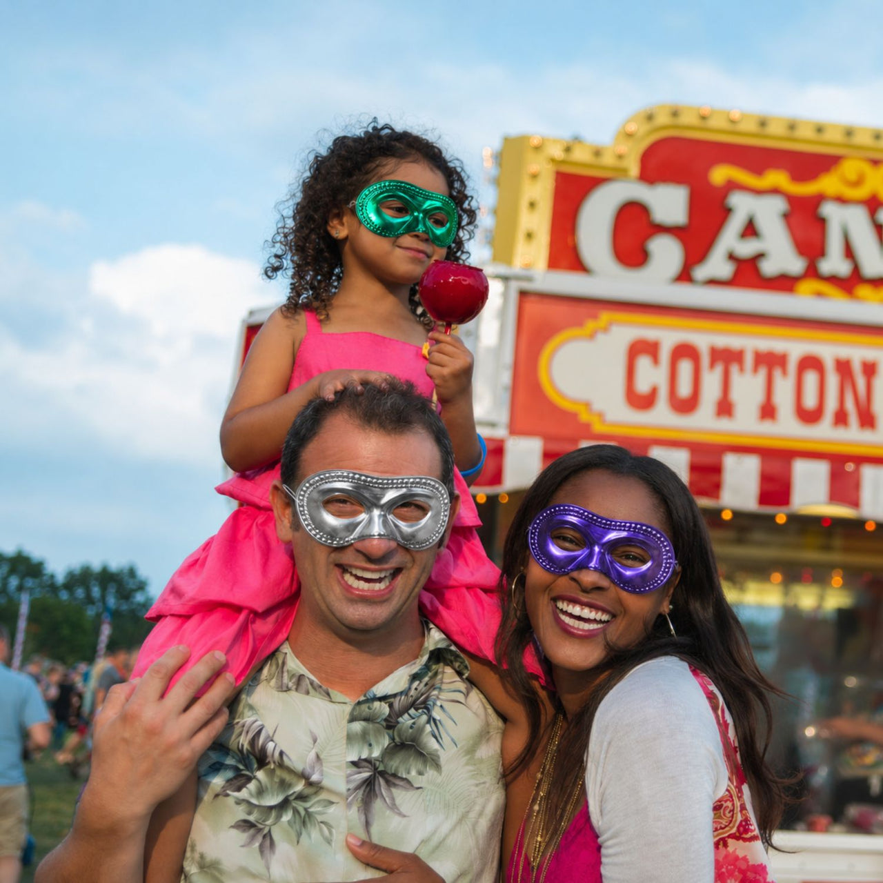 family at a carnival with carnival masks