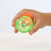 Thumbnail for flashing bouncing ball in a child's hand