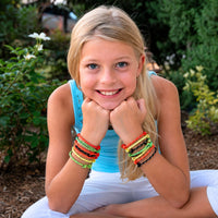 Thumbnail for girl smiling with friendship rope bracelets on her arms