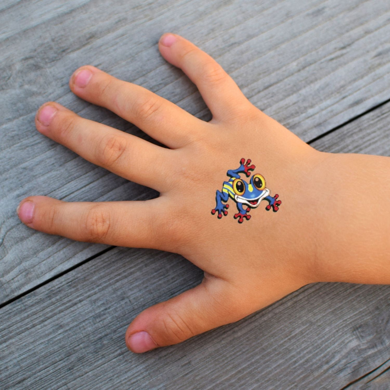closeup of frog tattoo on child's hand