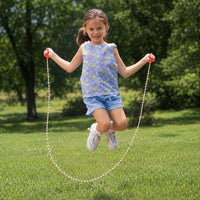 Thumbnail for girl outside paying jump rope