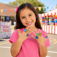 Thumbnail for girl outside smiling with many plastic rings 