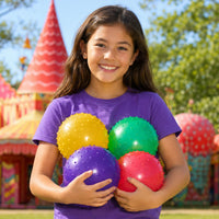 Thumbnail for girl outside with spike balls in her arms