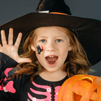 Thumbnail for girl in a witch hat with a temporary black cat tattoo 