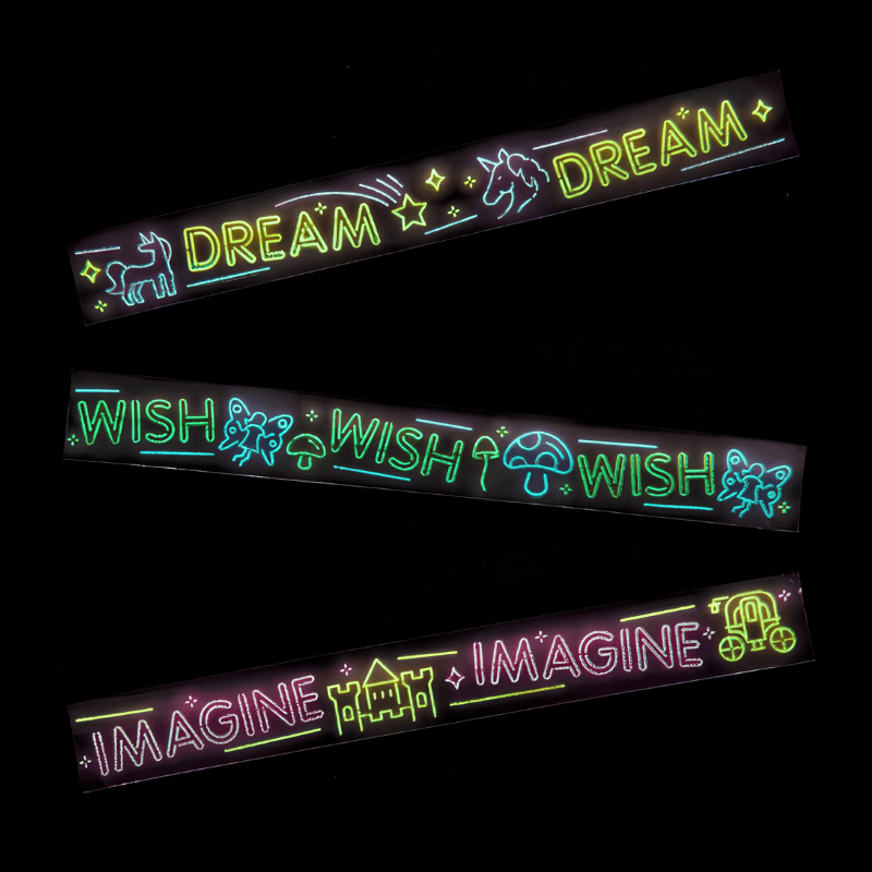 glow in the dark slap bracelets on black background