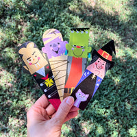 Thumbnail for halloween bookmarks held in a hand outside