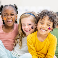 Thumbnail for children smiling with halloween temporary tattoos