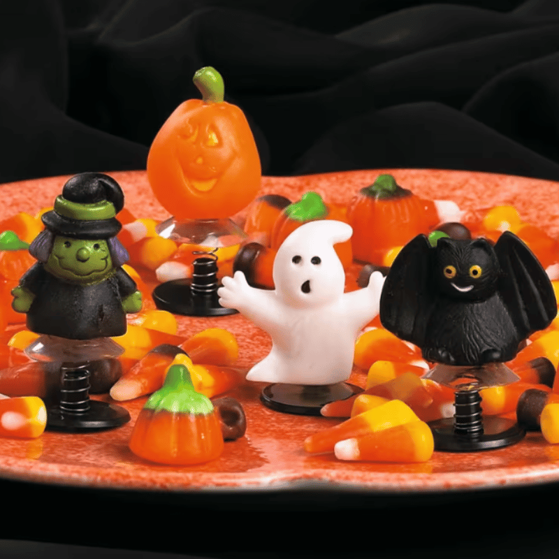 halloween toys with candy on a plate