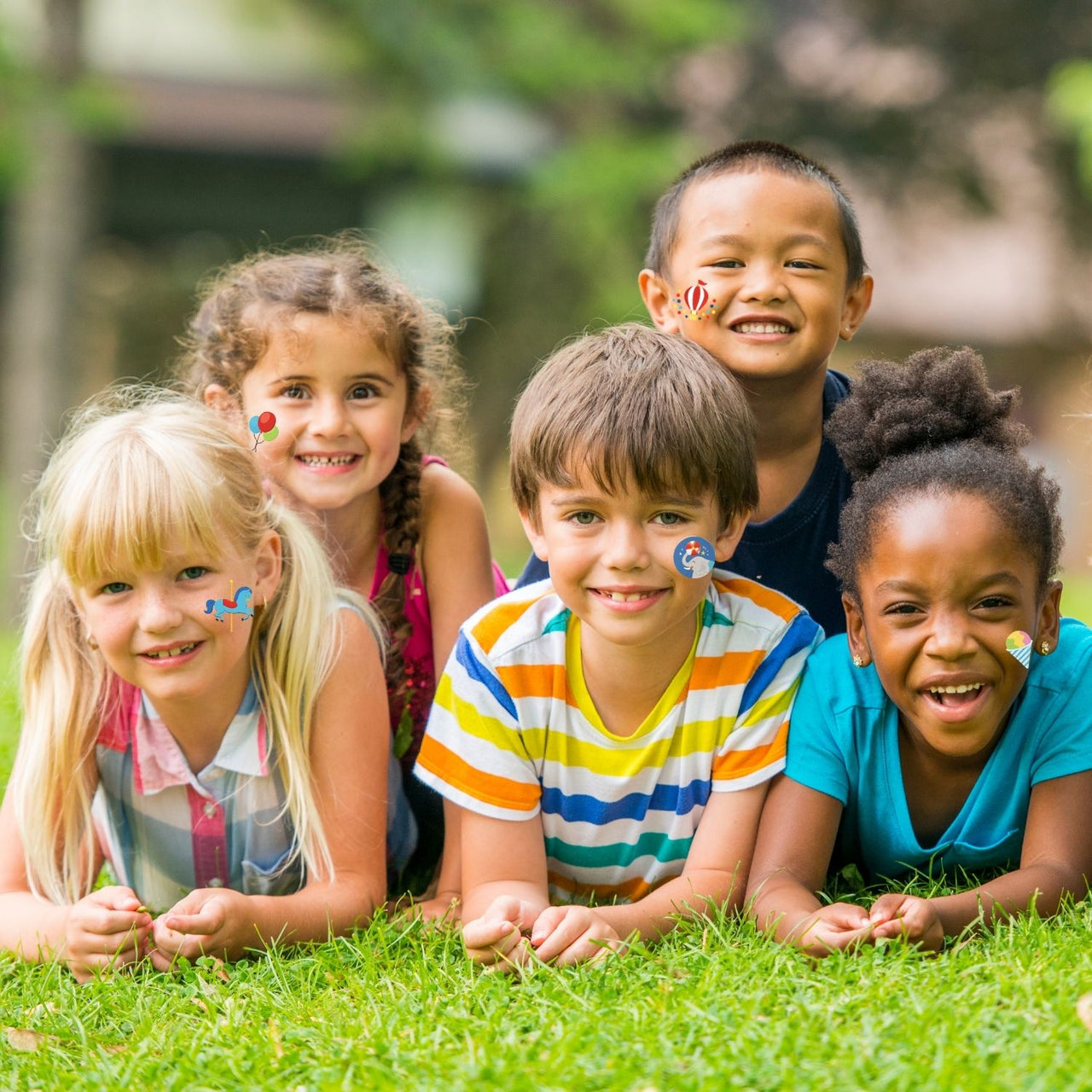 kids outside wearing carnival themed removable tattoos