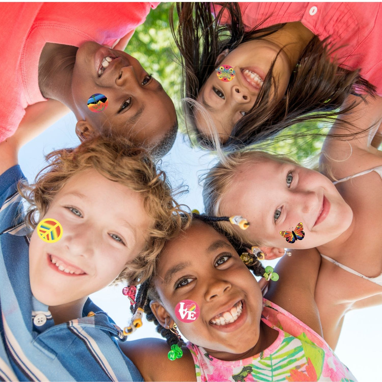 kids standing in a huddle with assorted temporary tattoos