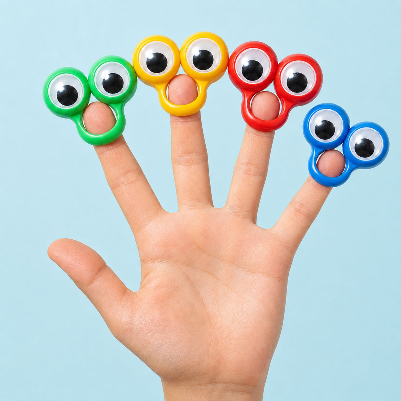 google eye peep rings on a childs fingers