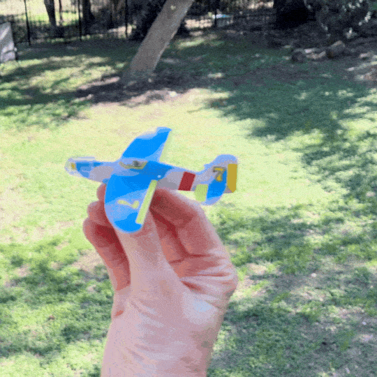 mini foam glider flying outside