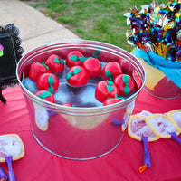 Thumbnail for Plastic apples floating in a large pail
