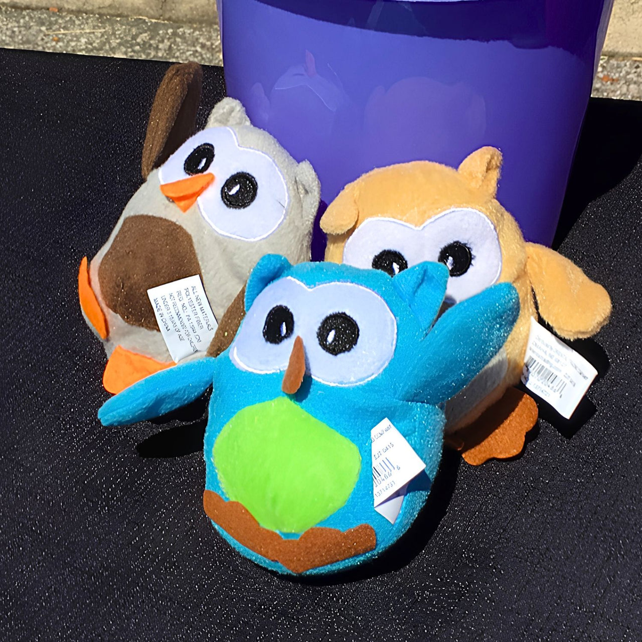 plush owls outside at a fall festival