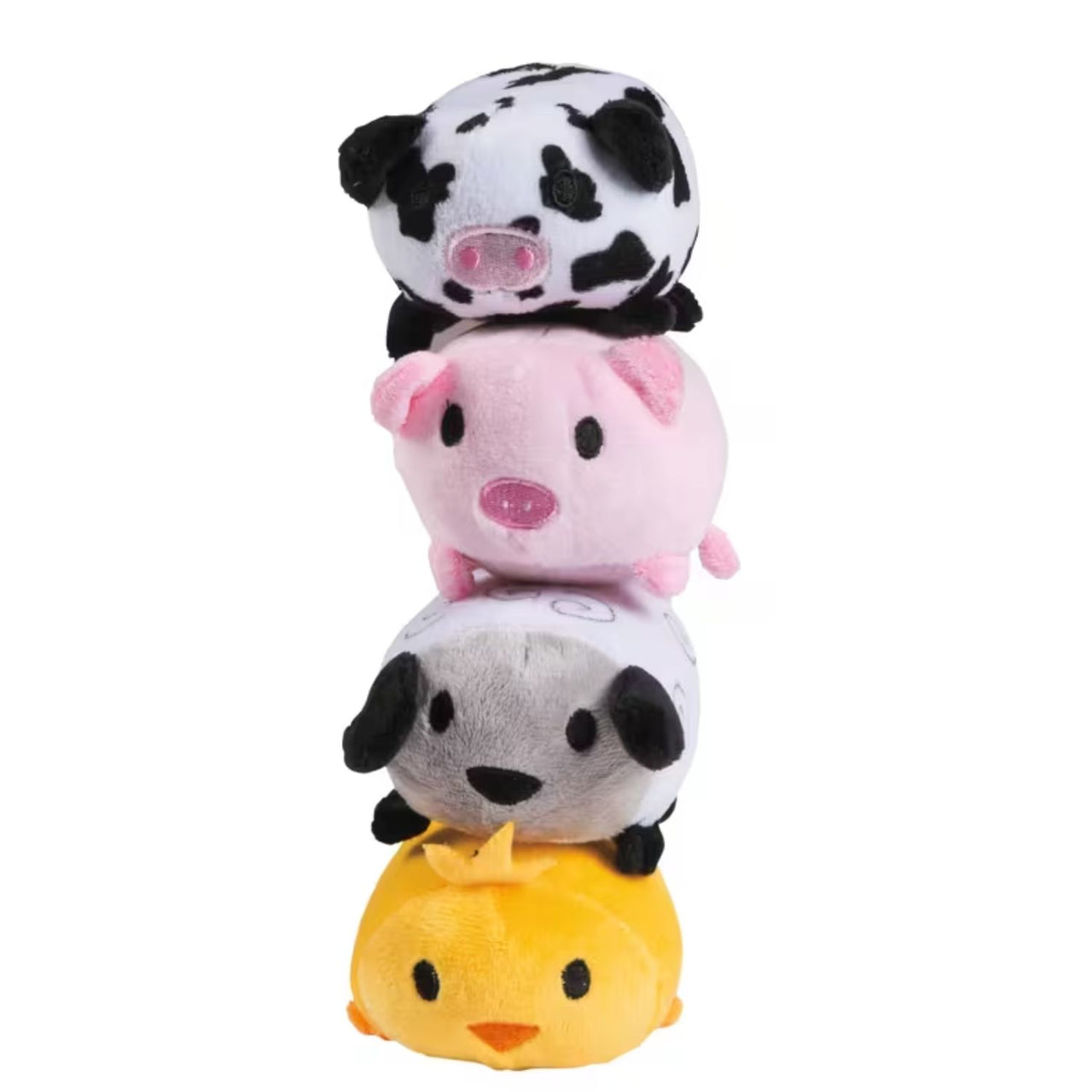a stack of small plush farm animals