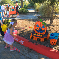 Thumbnail for preschool girl playing fall bean bag toss