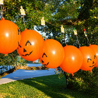 Thumbnail for pumpkin themed punch balls hanging outside