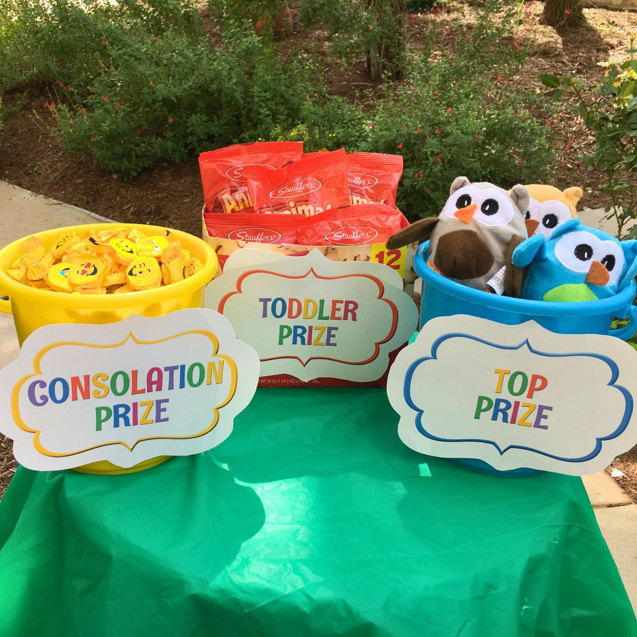 sand pails as carnival prize buckets outside filled with prizes
