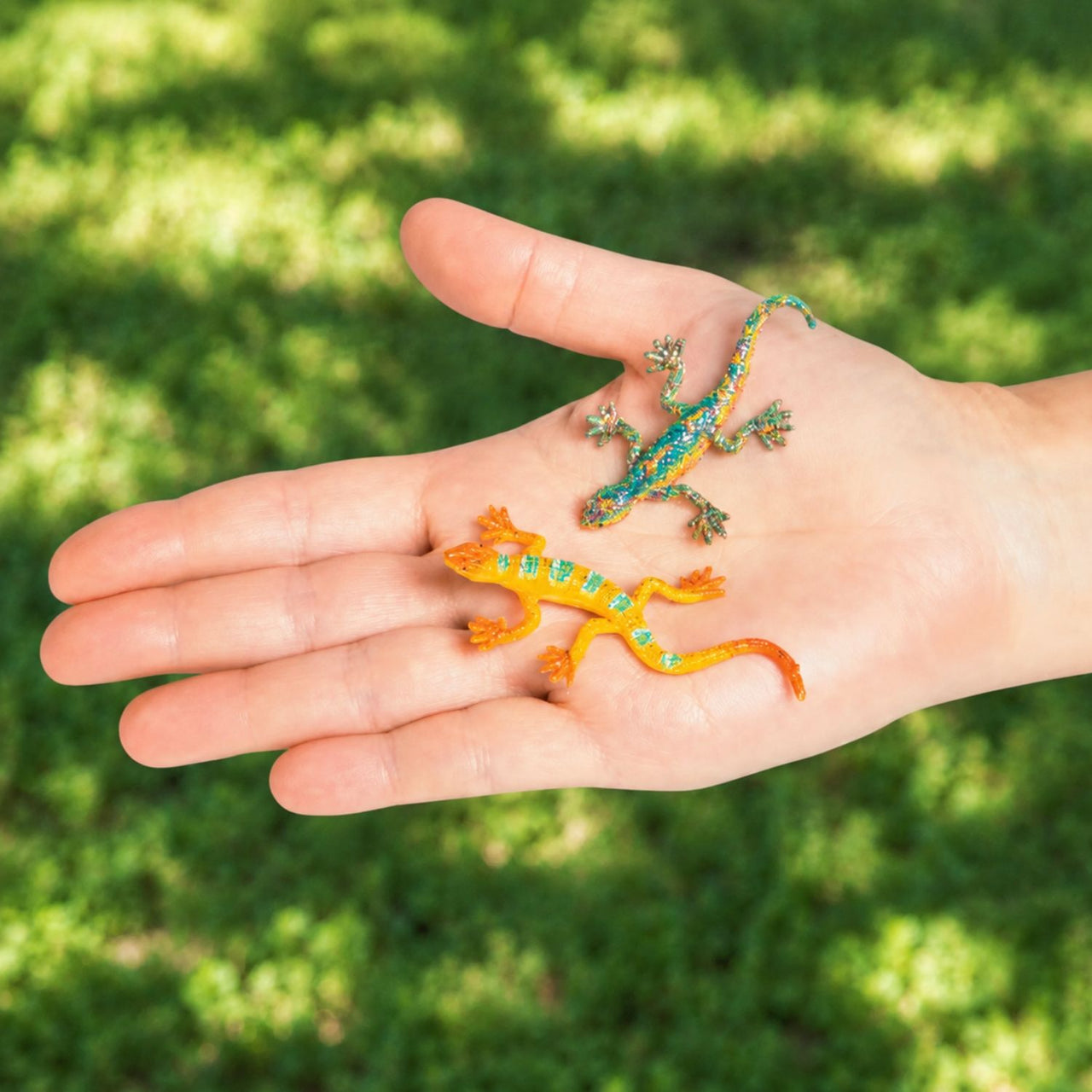 small toy glitter lizard in a hand