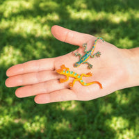 Thumbnail for small toy glitter lizard in a hand