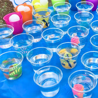 Thumbnail for cups with water and squirt fish for a game