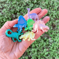 Thumbnail for squishy toy dinosaurs iin a hand