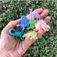 Thumbnail for close up colorful squishy dinosaurs in a hand