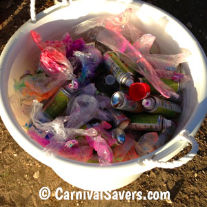 bucket-with-empty-colored-hairspay-bottles.jpg